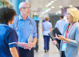 doctors talking in hospital corridor